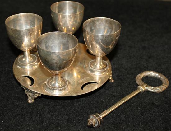 A George V silver four cup egg stand